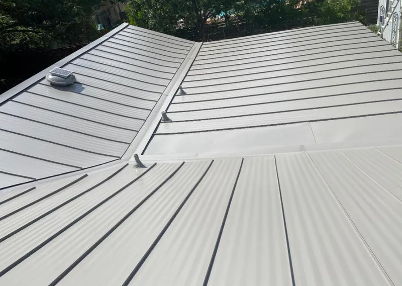 Solar attic fan installed on a metal roof for Roof Ventilation in Parkwood